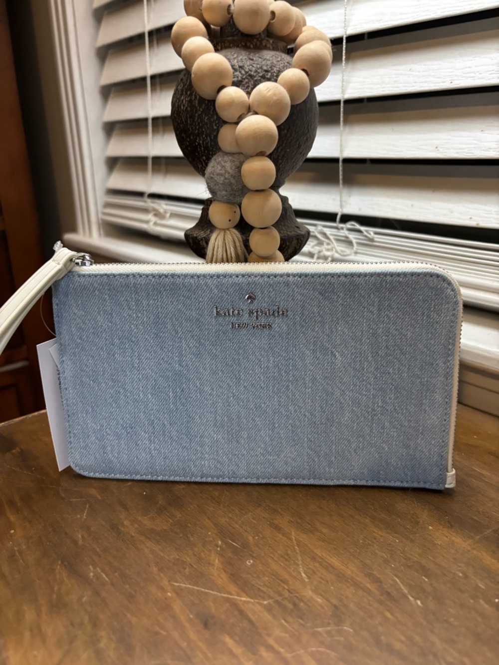 kate spade light blue denim zip-around wristlet